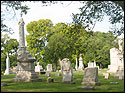 Elmwood Cemetery with grave stones and green trees