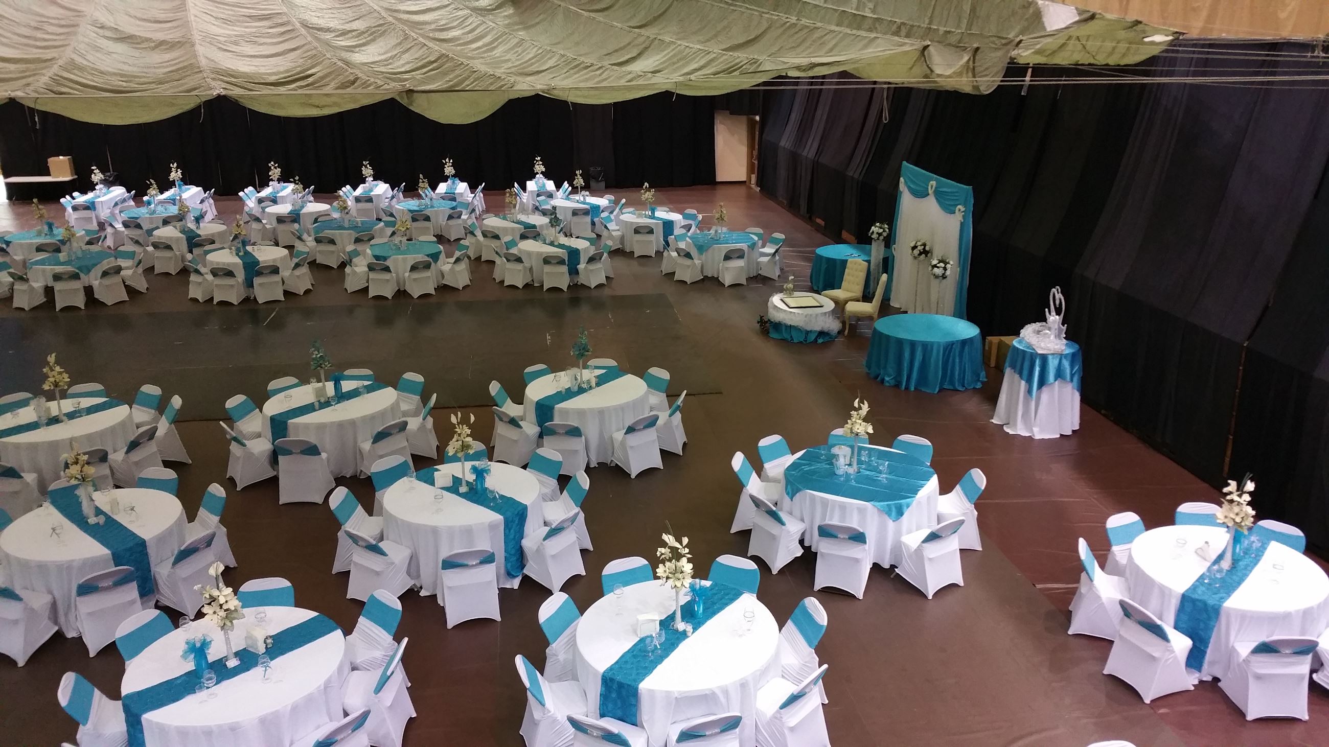 wedding reception view of dance floor, bride and groom seating, rectangle and round table arrangemen